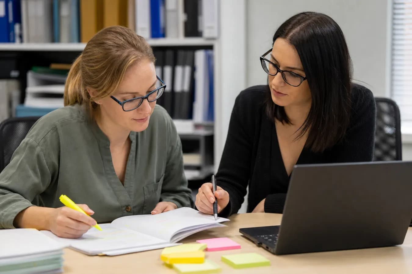 Quality reviewers checking clinical trial queries against source records